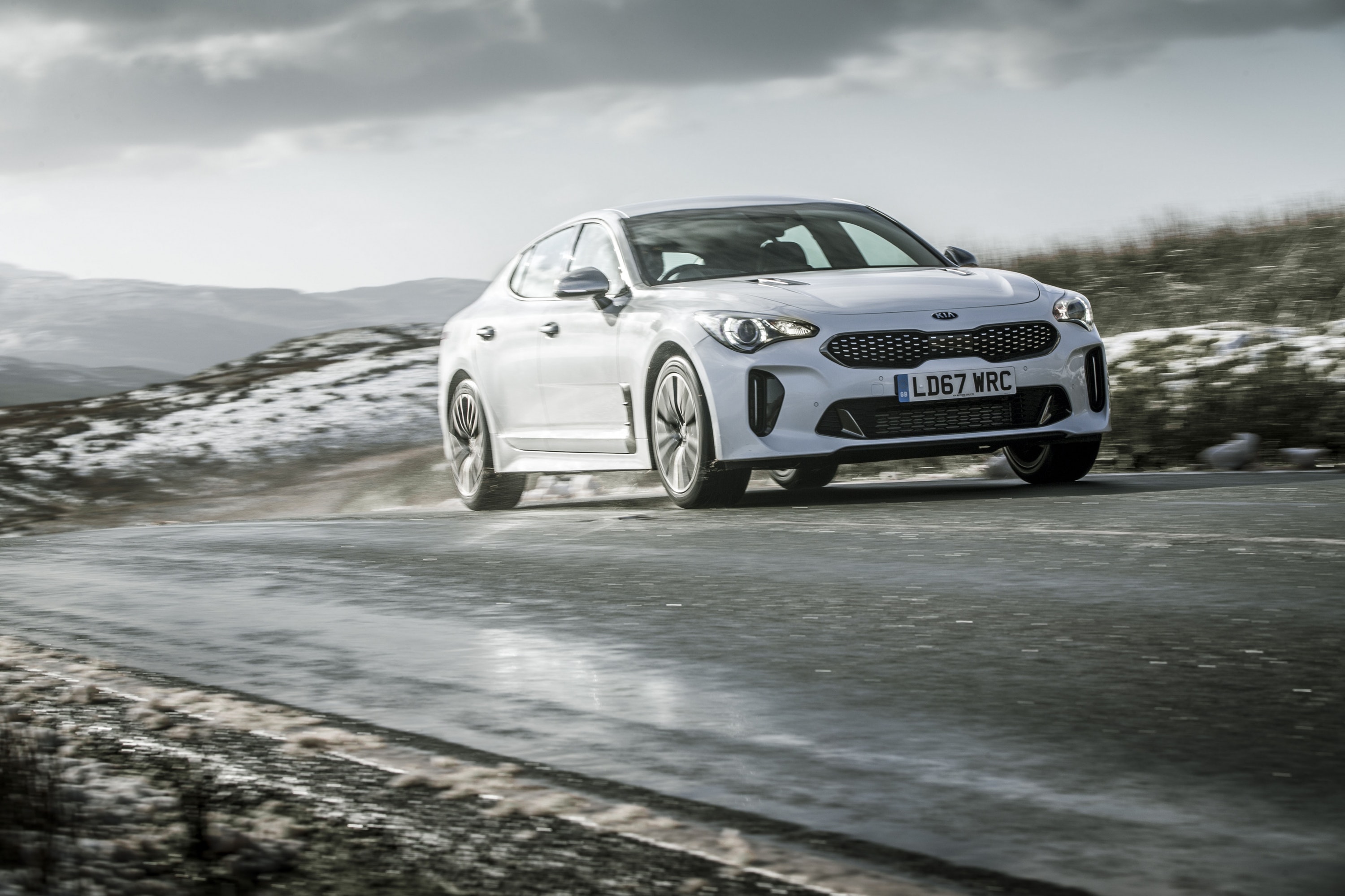 Stinger GT Line driving on a road